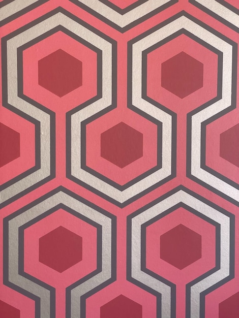 A wallpaper with a red and white pattern that says'the word " on it.