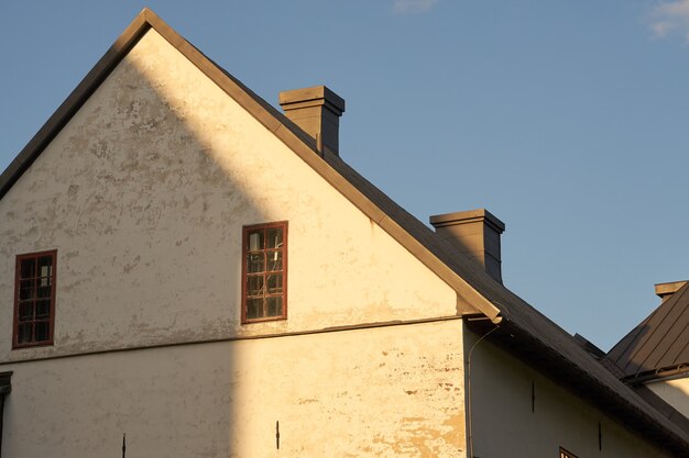 The walls of the ancient castle with a blue sky in the background.