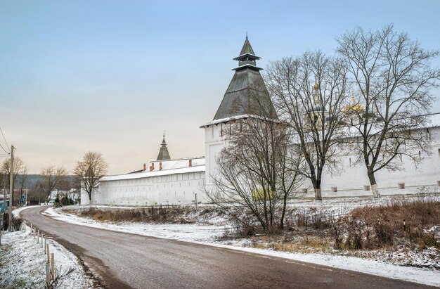 Walls and towers of the Pafnutiev Monastery in Borovsk on a cloudy winter day