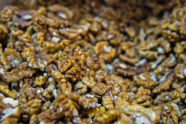 Walnut background selective focus on the individual nuts