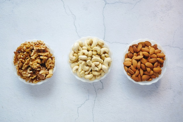 Walnut  cashew nut and almond in a container on table