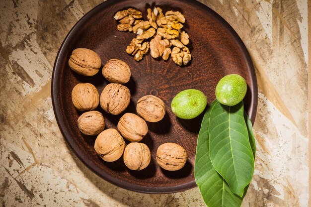 Walnut and a cracked walnut closeup shotPeas group in a bowl