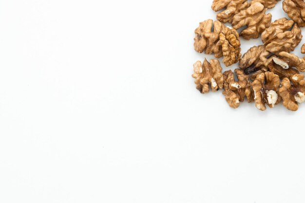 Walnut and a cracked walnut isolated on the white background