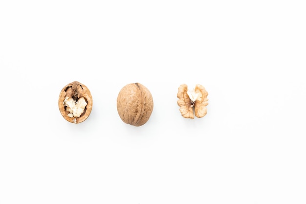 Walnut and a cracked walnut isolated on the white background