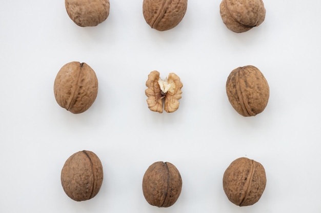 Walnut and a cracked walnut isolated on the white background