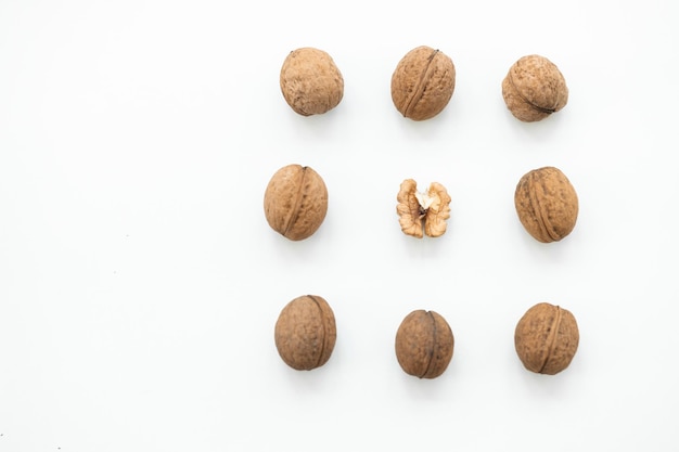 Walnut and a cracked walnut isolated on the white background