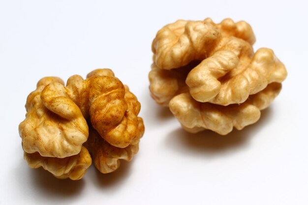 Walnut kernels on a white background