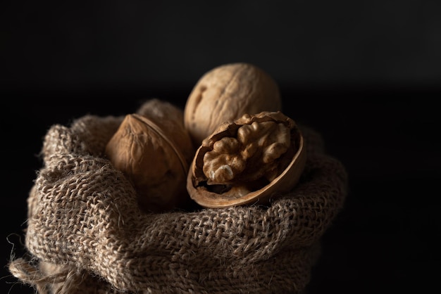 walnut in shell in a canvas bag