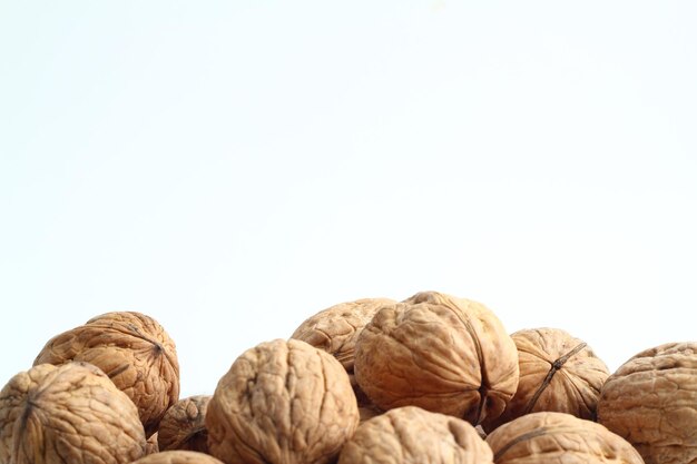 Walnut on the white background Close up shot of whole walnut isolated on white background