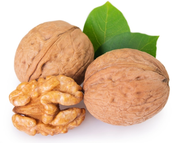 Walnut with leaf isolated on white background