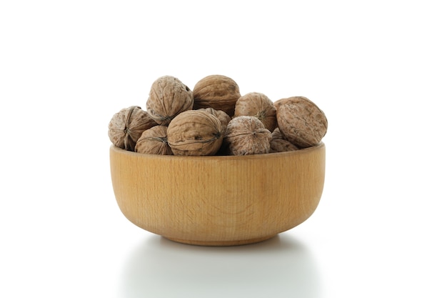 Walnuts in bowl isolated on white background