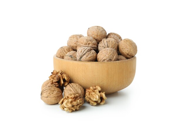 Walnuts in bowl isolated on white background