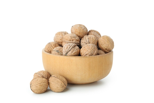 Walnuts in bowl isolated on white background