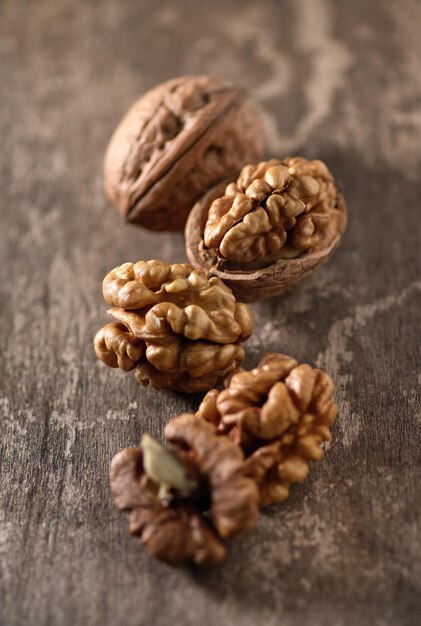 Walnuts in closeup on wooden background