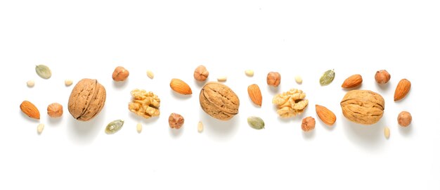 Walnuts, hazelnuts and almonds on white