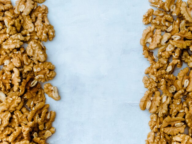 Walnuts kernel on light blue background, Top view.