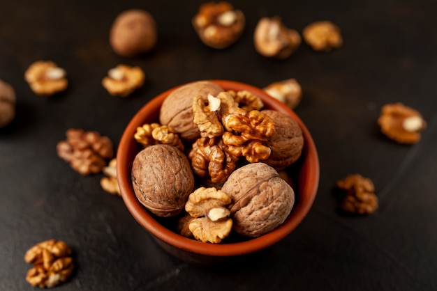 Walnuts. kernels and whole nuts on a stone background