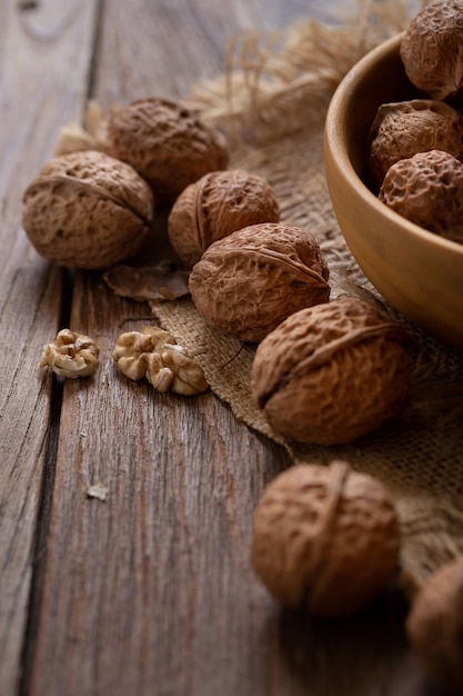 Walnuts kernels in wooden bowl