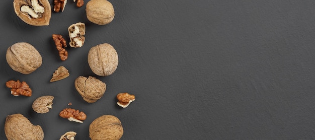 walnuts on a matte gray background closeup copy space top view