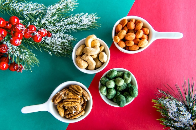 Walnuts, peanuts and cashews on a Christmas table.