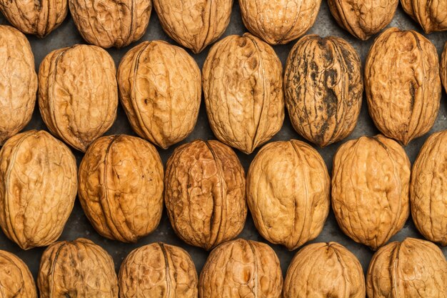 Walnuts on a rusted metal table in a top view