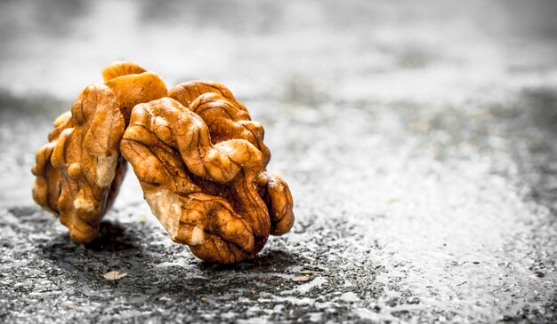 Walnuts on rustic table. Free text space