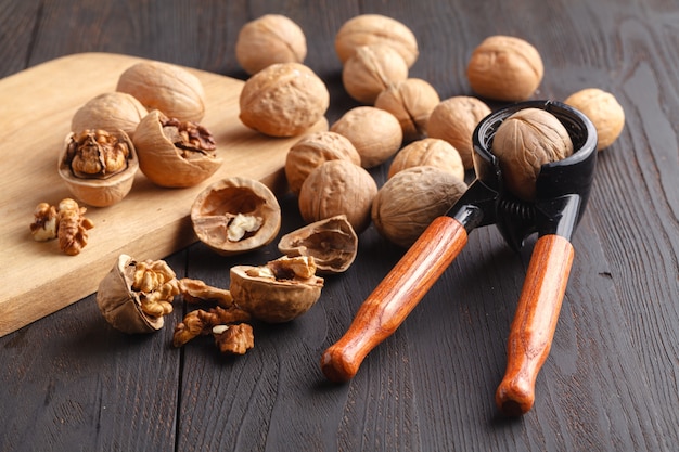 Walnuts splashed on the wooden table.