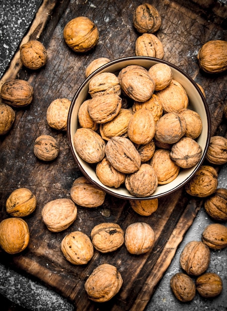 Walnuts unpeeled in a bowl