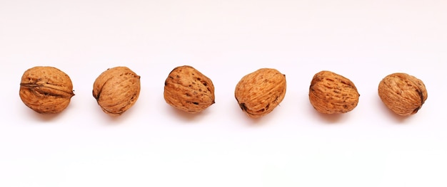 Walnuts on a white surface