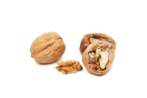 Walnuts whole and opened isolated on white background