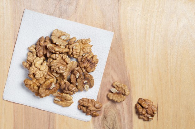 Walnuts on a wooden background