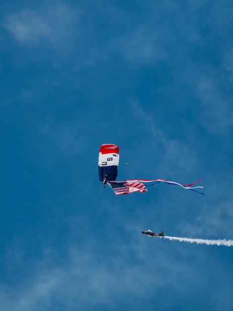 Walter Green flying the American flag at the Rocky Mountain Airshow in Broomfield, Colorado.