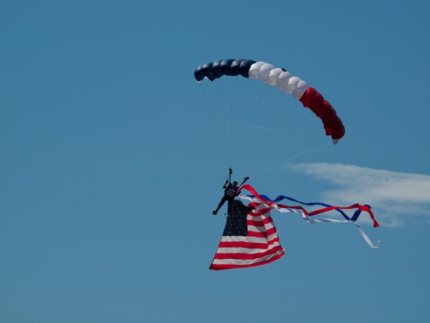 Walter Green flying the American flag at the Rocky Mountain Airshow in Broomfield, Colorado.