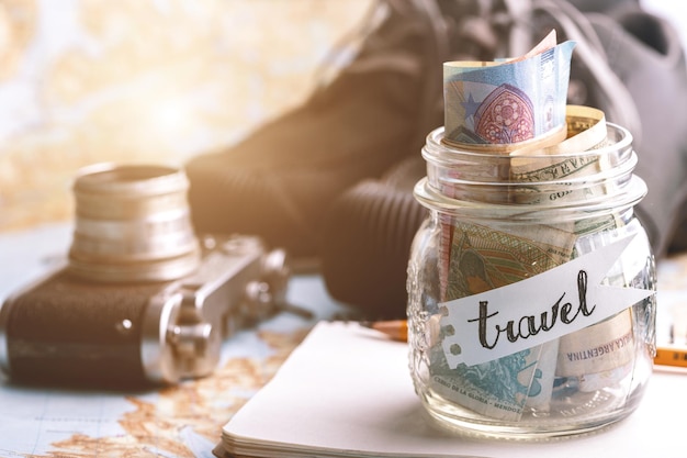 Wanderlust. adventure concept. background - what to take for a trip - camera, jar with money,  shoes