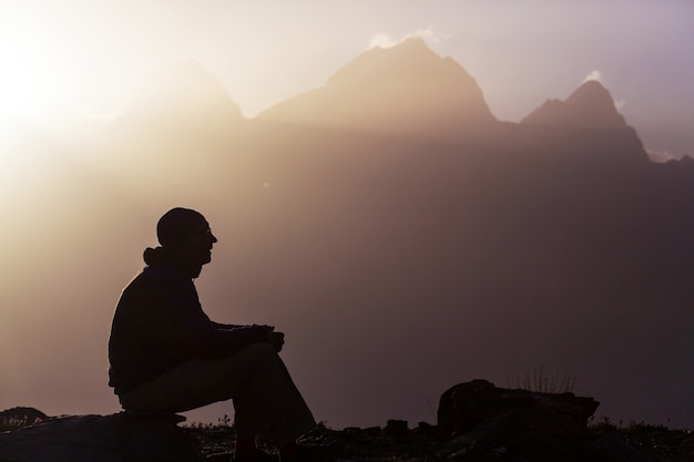 Wanderlust time. Man hiking in beautiful Fann mountains in Pamir, Tajikistan. Central Asia.