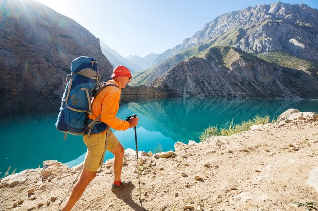 Wanderlust time. Man hiking in beautiful Fann mountains in Pamir, Tajikistan. Central Asia.