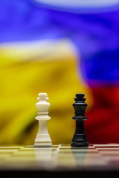 War between russia and ukraine conceptual image of war using\
chess board pieces and national flags on the background ukrainian\
russian crisis political conflict stop the war 2022