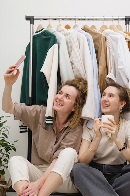 Wardrobe organization two female friends near Clothes rack