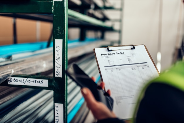 Warehouse clerk using phone