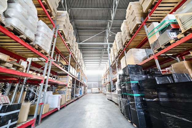 Warehouse of Commerce and Industry of transportation. Boxes and crates stocked on the shelves of three storey.