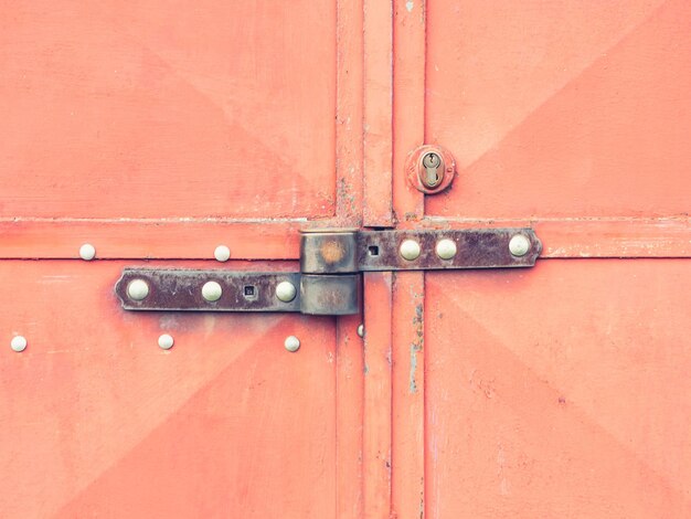 Photo warehouse door with security locked latch lock and safety lock insert in hardened metal plate