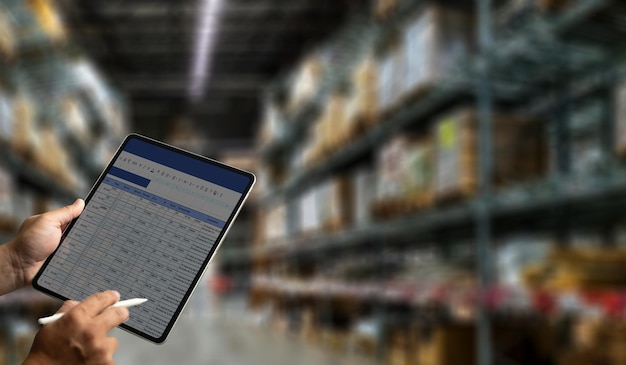 Photo warehouse management engineer holding tablet management dashboard electronic inventory management concept