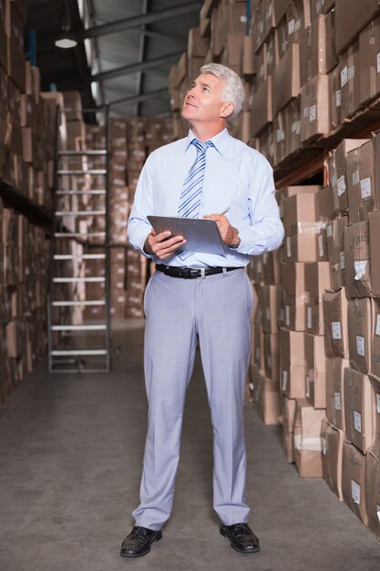 Warehouse manager checking his inventory