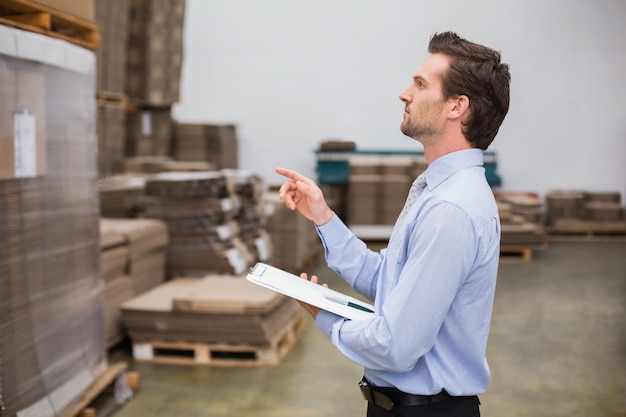 Warehouse manager checking his inventory