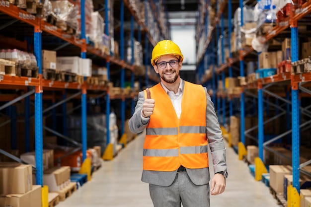 A warehouse manager is giving thumbs up for fulfilled commodity reserves