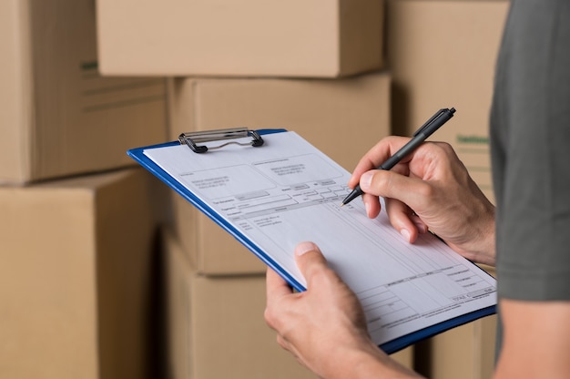 Photo warehouse manager signing dispatch sheet