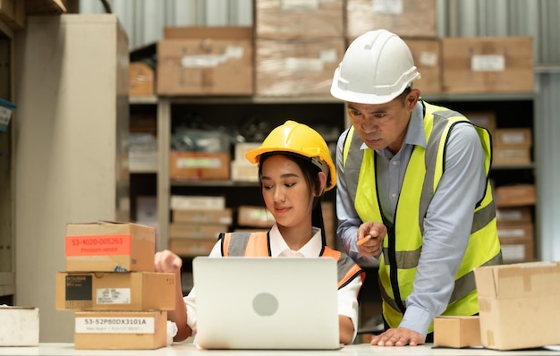 Photo warehouse manager with female assistant rethink a plan to prepare items that need to be sold to retailers during times of higher market prices