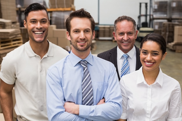 Warehouse team smiling at camera