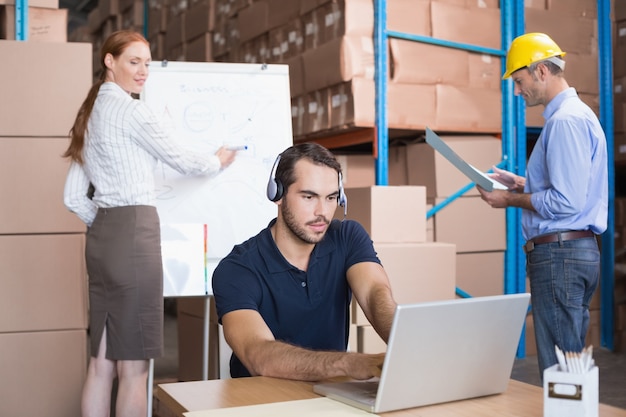 Warehouse team working together on shipment