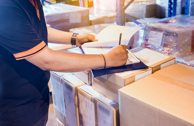 Photo warehouse worker are working in warehouse store with inventory the shipment.